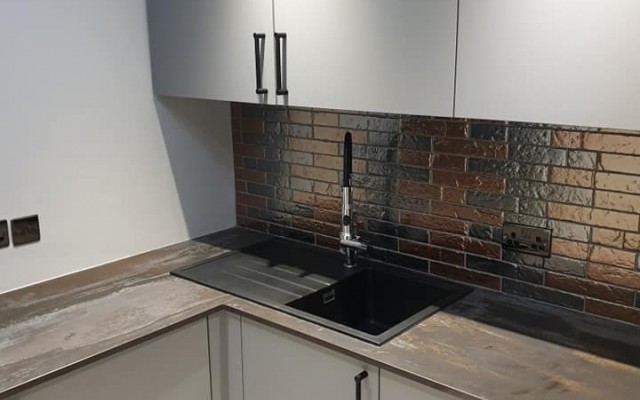 06 - Splash Kitchens & Bathrooms - Modern Kitchen with a Wood Surface